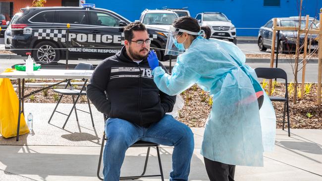 A man gets a COVID-19 test at a pop-up testing site in Melbourne’s west on July 2. The testing sites were set up across several suburbs as lockdowns were announced for 10 postcodes across Melbourne. Picture: Getty