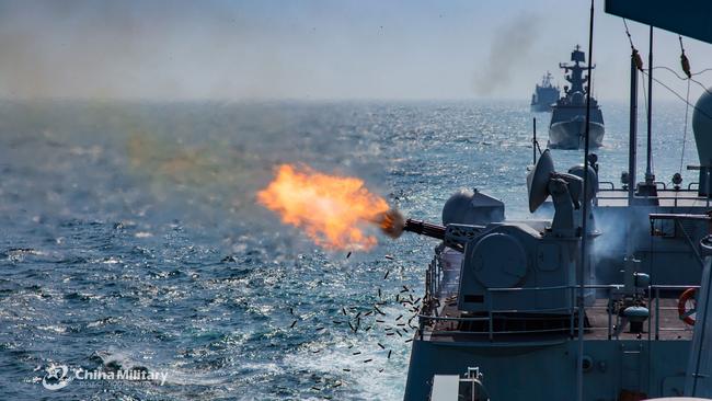The guided-missile destroyer Shenzhen fires its close-in weapons system at mock sea targets during a round-the-clock maritime training exercise in waters off the South China Sea. Picture: Supplied