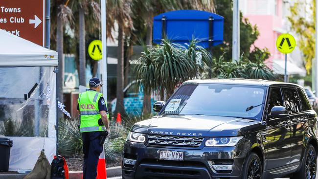 Police at the Queensland border checkpoint between Coolangatta and Tweed Heads. Picture: NIGEL HALLETT