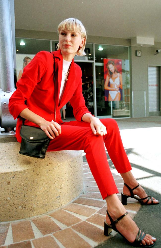 Erika Berner models clothing and accessories supplied by discout fashion stores at the harbour Town complex during its opening week in December 1999.