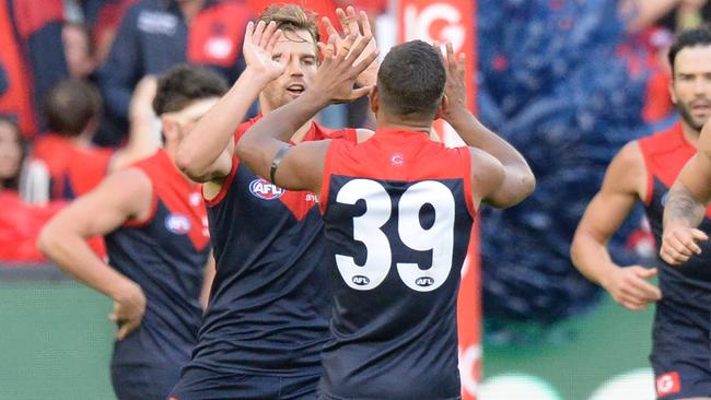 Dom Tyson celebrates a goal with Neville Jetta.