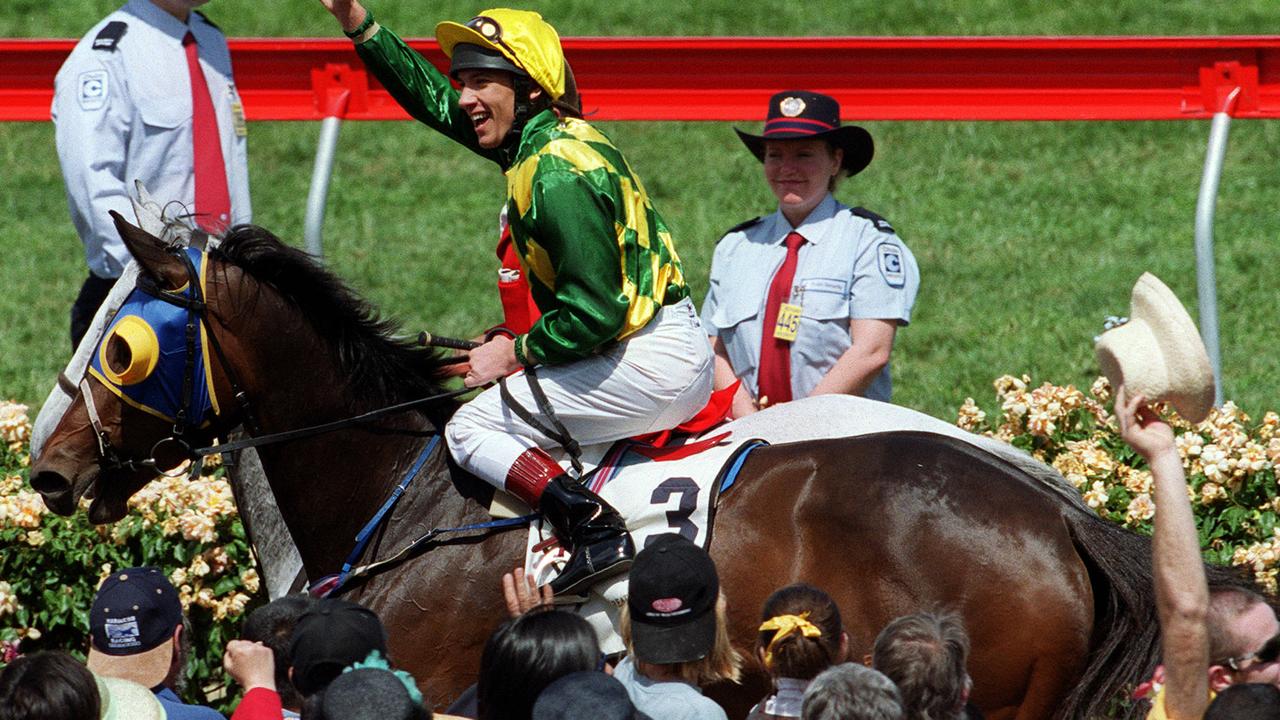 Horseracing - racehorse La Zoffany ridden by jockey Frankie Dettori returning to scale after winning Great Western race at Flemington 03 Nov 1999.