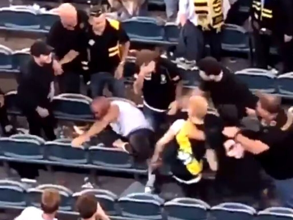 Footy brawl video: Three men charged over MCG fight | Herald Sun