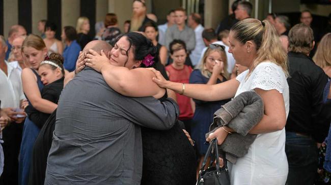 Lisa Harwick is consoled after the memorial service for her husband Brad Hardwick. Picture: Zizi Averill