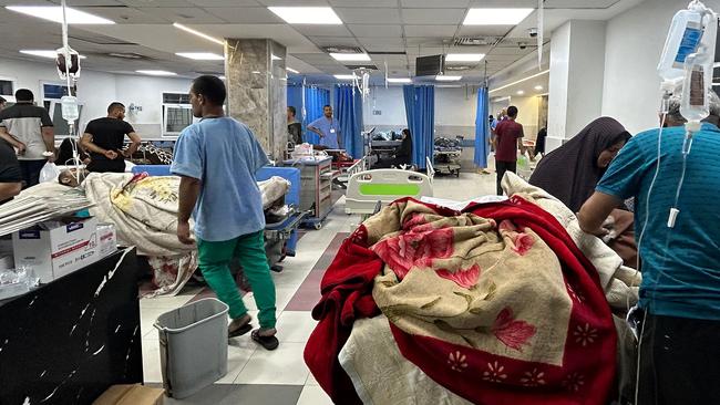 Patients inside Al-Shifa Hospital in Gaza City on Friday. Picture: AFP