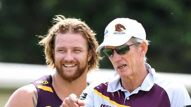 Korbin Sims (left) and coach Wayne Bennett look on during the Brisbane Bronco's training session at Red Hill in Brisbane, Monday, Feb. 27, 2017. The Bronco's will play the Cronulla Sharks in the season opener on Thursday. (AAP Image/Dave Hunt) NO ARCHIVING