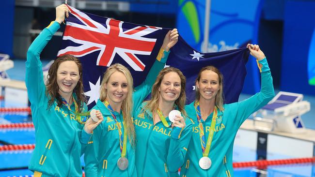 Cate Campbell, Taylor McKeown, Emily Seebohm and Emma McKeon celebrate with their silver medals. Picture: Alex Coppel.