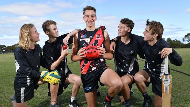 Kohan Hollitt, Jack Davidson, Riley Thilthorpe, Ben Kelly and Jaxon Pearson pose for a photograph at the Adelaide High School. Picture: AAP/Keryn Stevens.