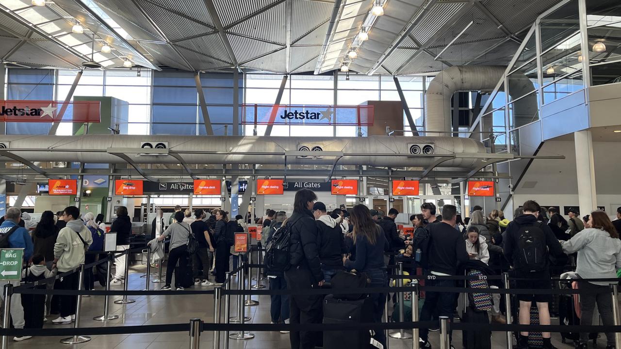 Travellers have been warned to expect further delays as strong winds cause chaos at Sydney Airport. There were multiple delayed and some cancelled domestic flights departing Sydney Airport on Saturday afternoon due to the weather. Picture: NewsWire