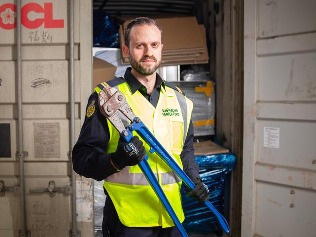 27-06-22 - Australian Border Force at Port Botany. Senior Border Force officer Daniel with a shipping container. Picture Ryan Osland