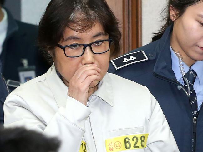 Choi Soon-Sil (C), who has been dubbed Korea's 