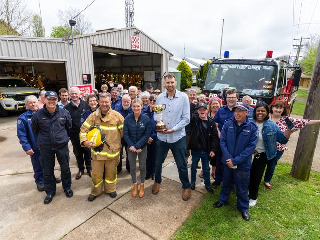 Jamie Kah and basketball great Chris Anstey with the Lexus Melbourne Cup trophy at Country Fire Authority in Trentham. Picture: Jay Town