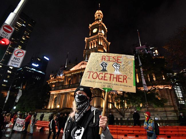 A protester at the Town Hall for last night’s Black Lives Matter rally. Picture: AFP