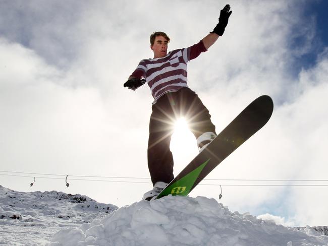 A fresh dump of white snow covers the mountain. Bass Linden of Lindisfarne on his snow board makes the most of the Ben Lomond snow by making a ramp and having some fun.