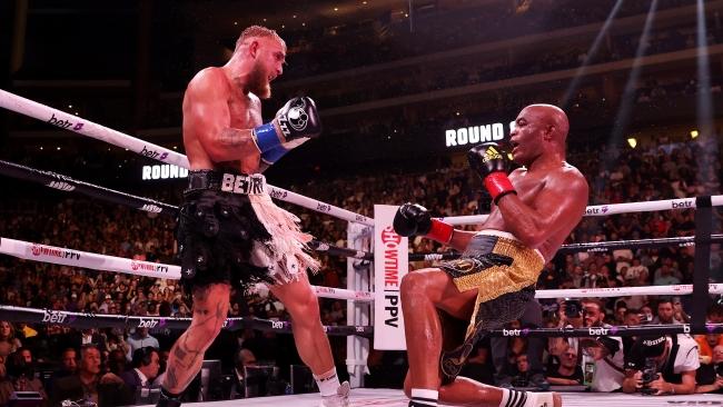 Jake Paul (L) knocks down Anderson Silva. (Photo by Christian Petersen/Getty Images)