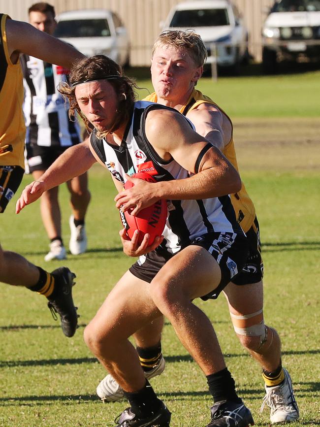 North Geelong's Rory Desnoy holds the ball under pressure from Bannockburn's Austin Mahoney. GDFNL North Geelong v Bannockburn. Picture: Alan Barber