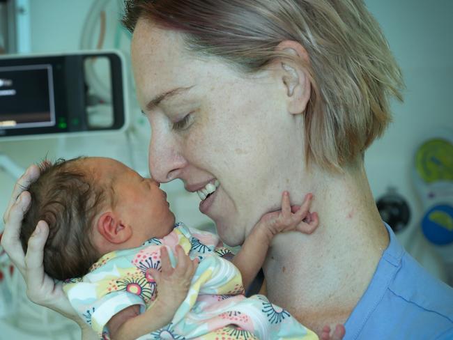 Early arrival: mum Meagan Wheelahan snuggles up to daughter Sabrina Hinga, who was born on December 9 at 36 weeks, 1 day. Picture: David Caird