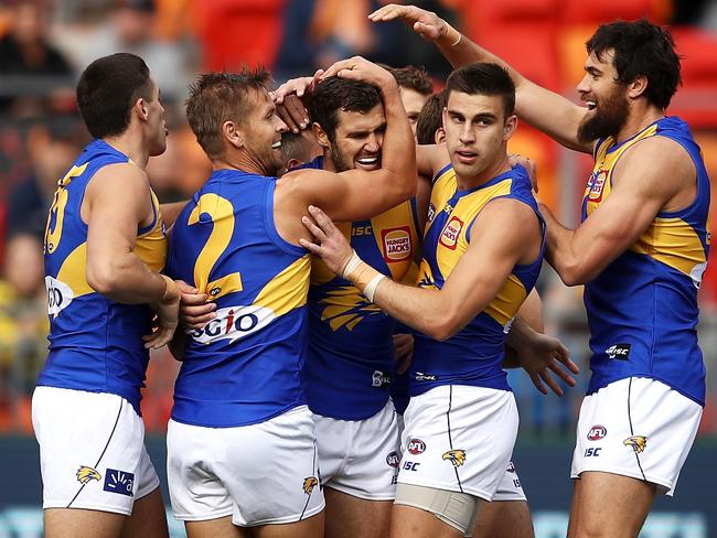 West Coast players get around Jack Darling after a vital goal against the Giants. Picture: Getty Images