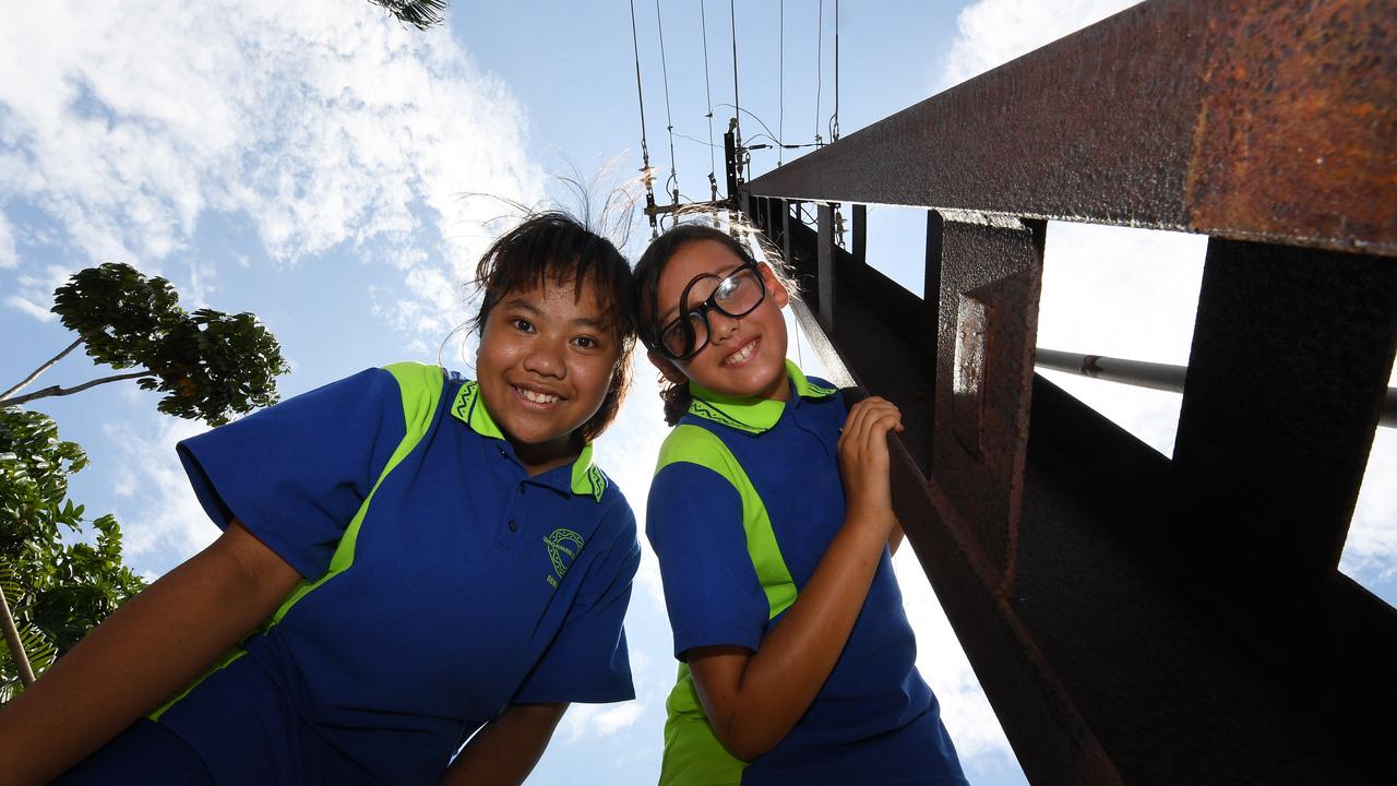 Wagaman Primary school students Shanti Malla and Ashaina Dela Cruz are happy that there school will be one of the first to have underground power lines as announced in 2019 by Treasurer Nicole Manison. Picture: Katrina Bridgeford.