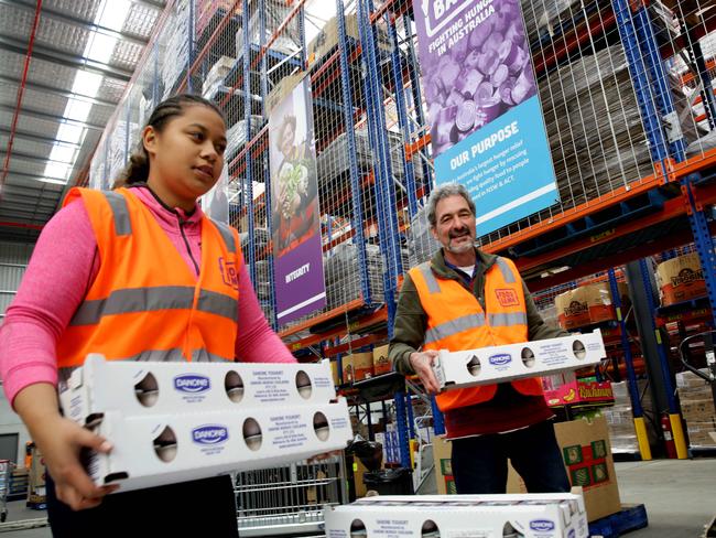 Do Something Day at Foodbank warehouse, Glendenning.Volunteers Luhama Palu and Bruce Riddell