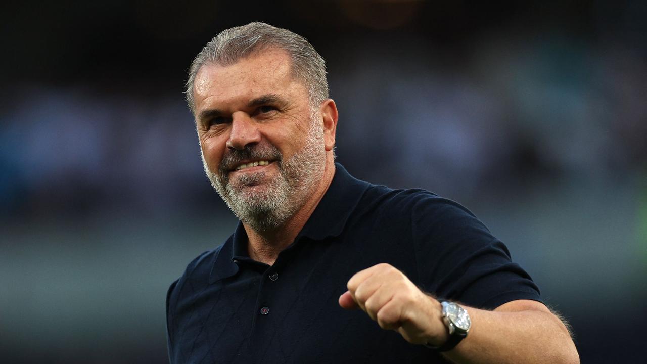 Ange Postecoglou celebrates. (Photo by Adrian DENNIS / AFP)