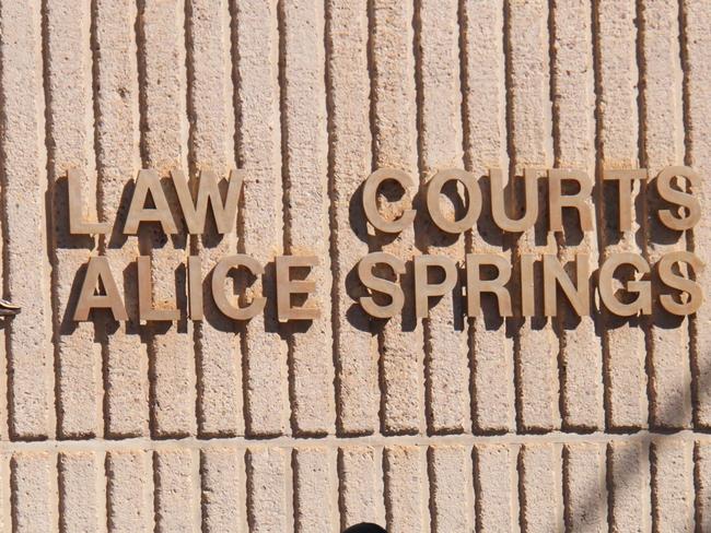 A Northern Territory policeman walks in front of the Alice Springs Local Court. Picture: Gera Kazakov