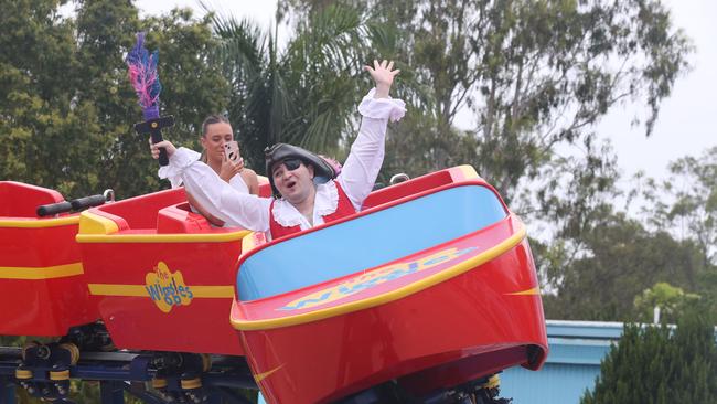 Test riding the new Wiggles Big Red Boat ride at Dreamorld are Captain Feathersword being filmed by Tahlia Leathart. The theme park is scheduled to reopen Wednesday after the weather impacted the Gold Coast theme parks. Picture Glenn Hampson