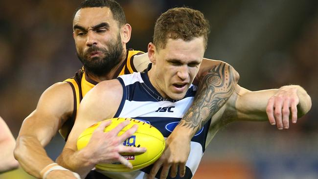 Joel Selwood cops a high tackle from Shaun Burgoyne. Picture: Michael Klein.