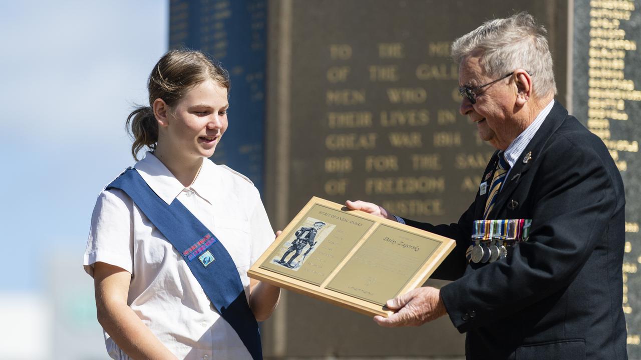 Daisy Zagorsky is presented the Spirit of Anzac Award by Lindsay Morrison at the Anzac Day Toowoomba mid-morning Service of Remembrance at the Mothers' Memorial, Tuesday, April 25, 2023. Picture: Kevin Farmer