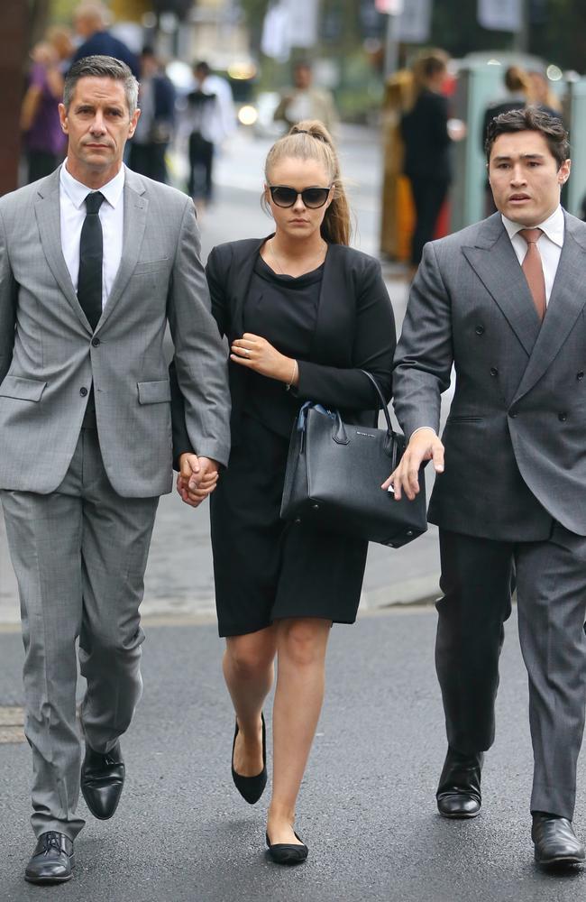 Roman Quaedvlieg, Sarah Rogers and their lawyer at Downing Centre Courts. Picture: John Grainger