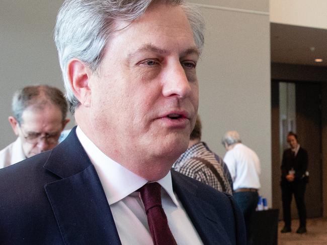 Managing Director and CEO of Westpac, Brian Hartzer (left) speaks to an attendee following the Wespac Annual General Meeting in Perth on Wednesday, December 12, 2018. (AAP Image/Richard Wainwright) NO ARCHIVING