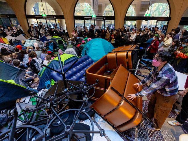 The protesters build a barricade. Picture: Jason Edwards