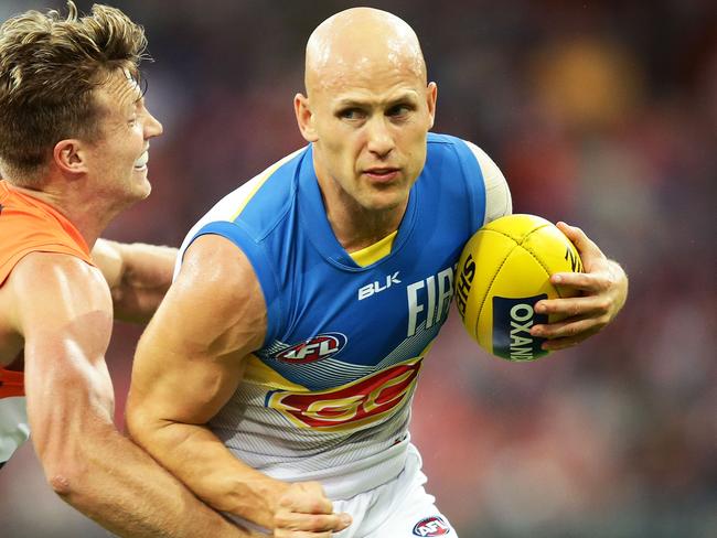 SYDNEY, NEW SOUTH WALES - MAY 14: Gary Ablett of the Suns is challenged by Rhys Palmer of the Giants during the round eight AFL match between the Greater Western Sydney Giants and the Gold Coast Suns at Spotless Stadium on May 14, 2016 in Sydney, Australia. (Photo by Matt King/AFL Media/Getty Images)