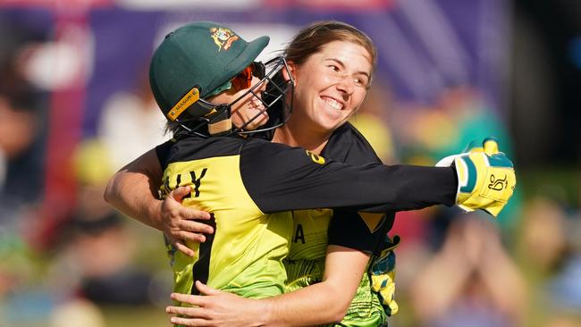 Player of the match Georgia Wareham, right, celebrates with Alyssa Healy after the legspinner claimed a key wicket in Australia’s four-run win over New Zealand. Picture: AAP