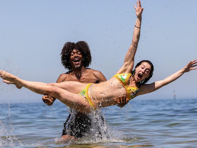 Brandon Mathis and Angel Mammoliti had a swim at St Kilda beach. Picture: Ian Currie