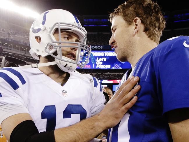 Indianapolis Colts quarterback Andrew Luck (12) and New York Giants' Eli Manning (10) talk after an NFL football game Monday, Nov. 3, 2014, in East Rutherford, N.J. The Colts won 40-24. (AP Photo/Kathy Willens)