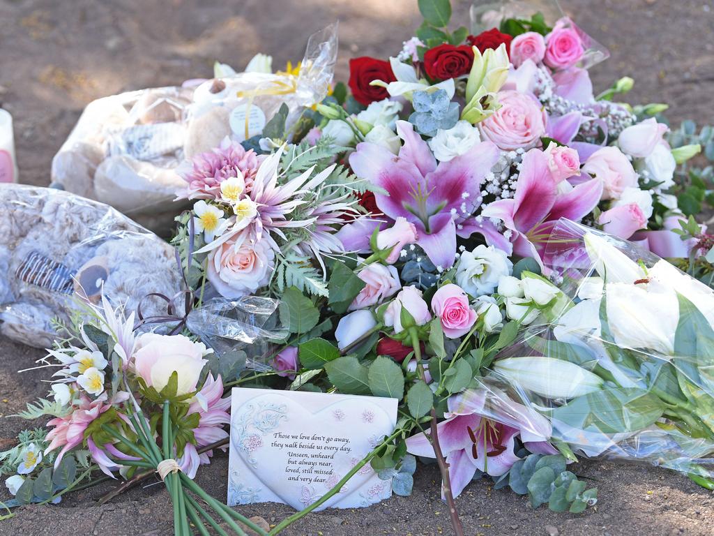 Flowers, teddy bears and candles were laid at a memorial. Picture: Tom Huntley