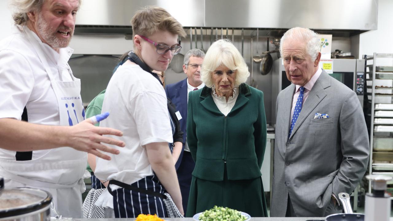 King Charles III and Queen Camilla meet staff in the kitchen during the launch of the Coronation Food Project and the visit to the South Oxfordshire Food and Education Alliance, a surplus food distribution centre, on November 14, 2023. (Photo by Ian Vogler – WPA Pool/Getty Images)