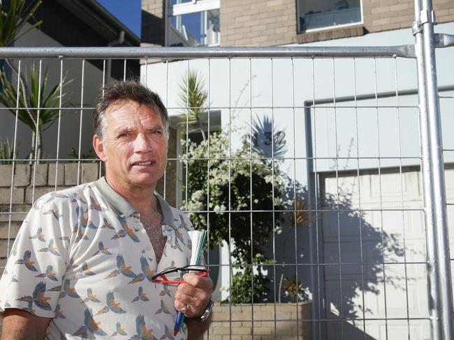 Garry Silk in front of his house which is so damaged he cannot return to it. At Collaroy where houses have been eaten by the recent storms. Picture: Marin Lange