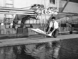 A 1961 landing test of a Dyna-Soar model in a tow tank at Langley air base.