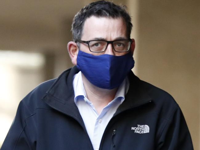 MELBOURNE, AUSTRALIA - JULY 19: Victorian Premier Daniel Andrews wears a face mask as he walks in to the daily briefing on July 19, 2020 in Melbourne, Australia. Metropolitan Melbourne and the Mitchell shire are currently in lockdown following the rise in COVID-19 cases through community transmissions. The new restrictions came into effect on Thursday 9 July, with residents in lockdown areas under stay at home orders until 19 August. People are only able to leave home for exercise or work, to buy essential items including food or to access childcare and healthcare. (Photo by Darrian Traynor/Getty Images)