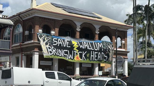 A banner hangs above the Santos Organic store in Mullumbimby reading: 'Save Wallum Brunswick Heads'. Picture: Savannah Pocock