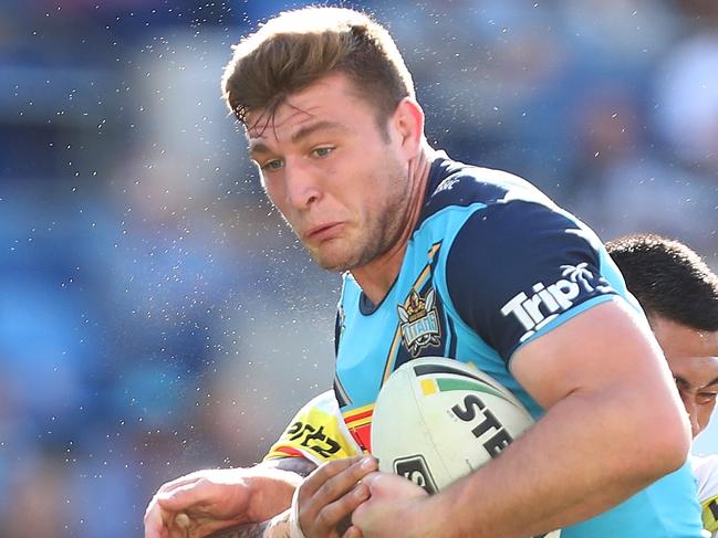 GOLD COAST, AUSTRALIA - AUGUST 11:  Jai Arrow of the Titans is tackeld during the round 22 NRL match between the Gold Coast Titans and the Penrith Panthers at Cbus Super Stadium on August 11, 2018 in Gold Coast, Australia.  (Photo by Chris Hyde/Getty Images)