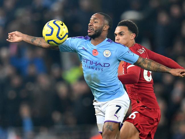 Manchester City's English midfielder Raheem Sterling (L) vies with Liverpool's English defender Trent Alexander-Arnold (R) during the English Premier League football match between Liverpool and Manchester City at Anfield in Liverpool, north west England on November 10, 2019. (Photo by Paul ELLIS / AFP) / RESTRICTED TO EDITORIAL USE. No use with unauthorized audio, video, data, fixture lists, club/league logos or 'live' services. Online in-match use limited to 120 images. An additional 40 images may be used in extra time. No video emulation. Social media in-match use limited to 120 images. An additional 40 images may be used in extra time. No use in betting publications, games or single club/league/player publications. /