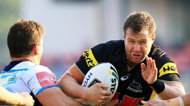 Trent Merrin of the Panthers tackled by Greg Bird during the Penrith Panthers v Gold Coast Titans NRL round 11 game at Pepper Stadium, Penrith. pic Mark Evans