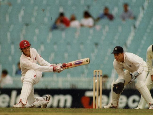 Greg Blewett sweeps another boundary on his way to 268, the best innings Darrell Holt saw in his many years as an umpire.