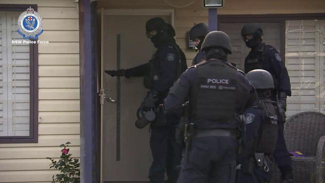 Three people were charged after $210,000 cash seized and an alleged hydro house located as part of international money-laundering investigation Picture: NSW Police