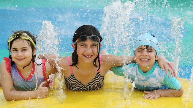 Lucinda, 7, Sienna, 9, and Nicholas, 4, love to cool off at the Brunswick Baths. Picture: Janine Eastgate