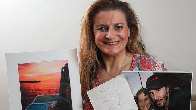 Nicole Lewis-Jacobs got a photo and an autograph from Keanu Reeves and now wants to send him some artwork of Bondi Beach. Picture: Ian Currie