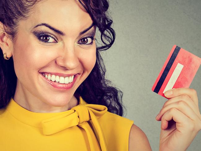 Happy woman holding credit card Picture: iStock.